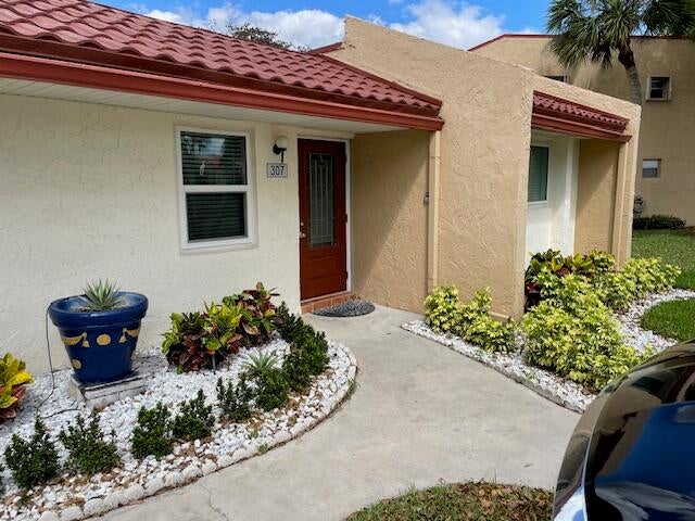 Photo of 307 LAKE EVELYN Drive, West Palm Beach, FL 33411 (MLS # B26074053)