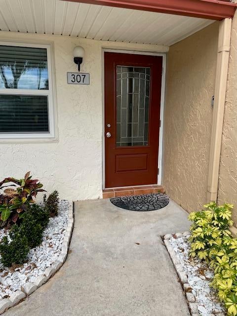 Photo of 307 LAKE EVELYN Drive, West Palm Beach, FL 33411 (MLS # B26074053)