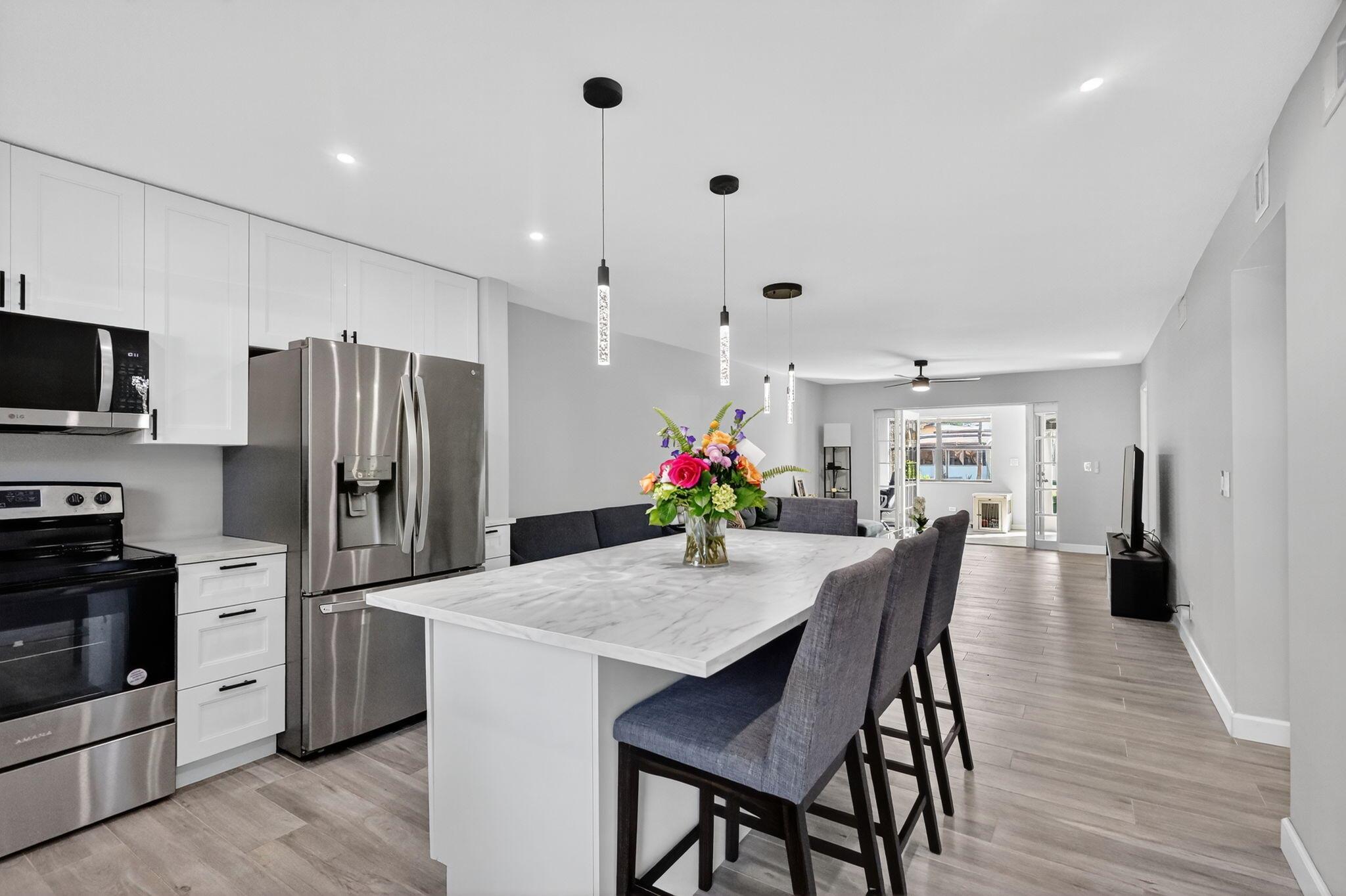 Welcome to 275 Gate Road #117 in the sought-after Carriage Hills community! While Carriage Hills is a 55+ community, this particular building is not age-restricted, offering flexibility for a wider range of buyers. This 2B/2Ba, condo features a fully remodeled kitchen and bathrooms, modern finishes, and a bright sunroom perfect for relaxing or entertaining. Enjoy resort-style amenities including three pools, a hot tub, clubhouse with billiards, library, and card tables, fitness center, tennis courts, and gated entry. Monthly maintenance fee of $548.59 includes water, garbage, and cable TV plus your choice of home phone or internet. Minimum credit score: 650. Conveniently located near the Seminole Hard Rock Guitar Hotel, shopping, dining, and major highways,. Move-in ready!