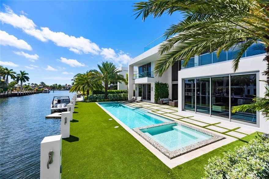 Exquisite residence nestled on the east fork of the point on Mola Ave. One of only three waterfront private properties secured by a private gate, this modern, newly constructed custom residence provides a serene, elegant oasis while being ideally located on Las Olas Blvd. Custom built by Bomar Builders, professionally decorated and furnished, this 5 bedroom, 6 1/2 bathroom residence is spectacularly designed for south Florida living with interior areas extended with outdoor spaces. Relax on your yacht, docked on your private 75ft concrete dock, or on your 3rd floor terrace with 270 degree views of Fort Lauderdale. Use the additional 42ft of waterfront to dock and launch your paddle board, wave runners and other waterfront accessories.