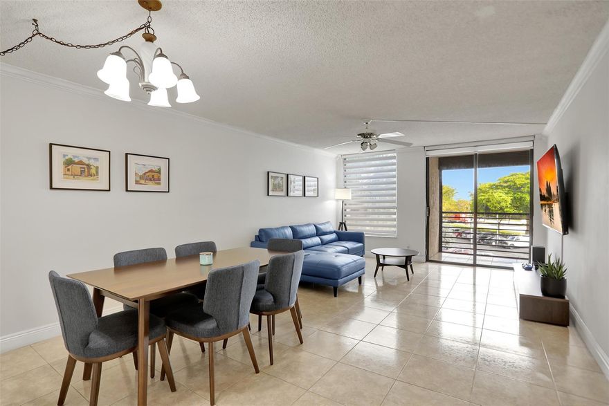 Beautiful move in ready 2 bedroom, 2 bath unit in an amazing location! Freshly painted, with renovated kitchen and new cabinets, crown molding, baseboards, and tile floor throughout. Screened patio, Hurricane shutters. Community pool and club house. Good for investors! Special Assessment $294 monthly for 12 years.