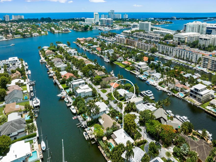 ATTENTION ALL BOATERS: Experience deep waterfront living at it's finest. This one story residence is situated in East Fort Lauderdale's subdivision of Lauderdale Harbors & offers 70 feet of water frontage, a wide canal measuring over 140 feet plus immediate access to the Intracoastal waterway & inlet to the Atlantic Ocean. This bright open floor plan features a great room & family room with a wall of glass that overlook the pool & patio area, tiki hut & waterway.  The water side primary suite with a private bathroom boast private access to a covered Lani overlooking the tropical pool area. 2 additional bedrooms share a full bathroom. This residence offers the ability to update or build your dream home. Mins. to shopping, resturants, gyms, the Lauderdale Yacht Club & more. Sq ft from BCPA.