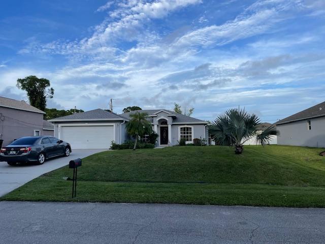 Photo of 4425 SW Farmington Street, Port Saint Lucie, FL 34953 (MLS # R10942920)