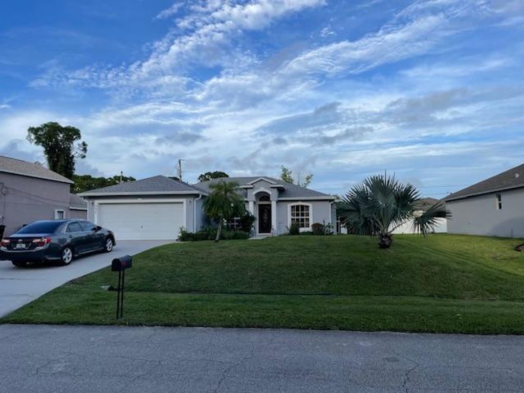 Photo of 4425 SW Farmington Street, Port Saint Lucie, FL 34953 (MLS # R10942920)