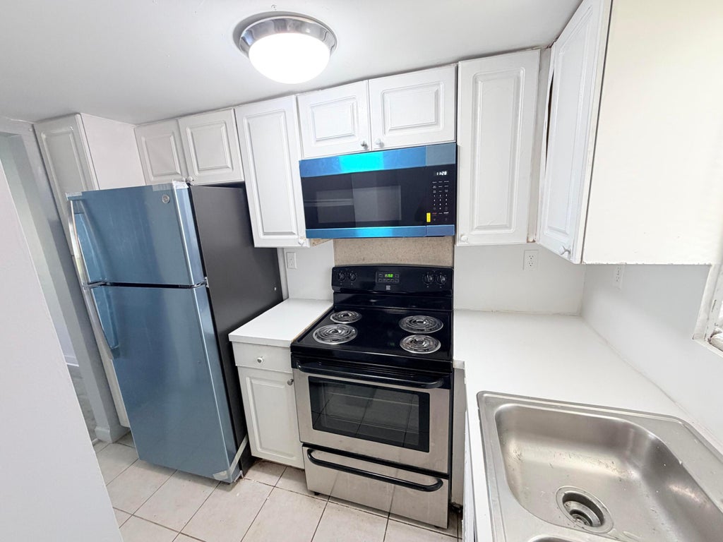 Photo of 1501 CRESCENT Circle #C19, Lake Park, FL 33403 (MLS # B26061666)