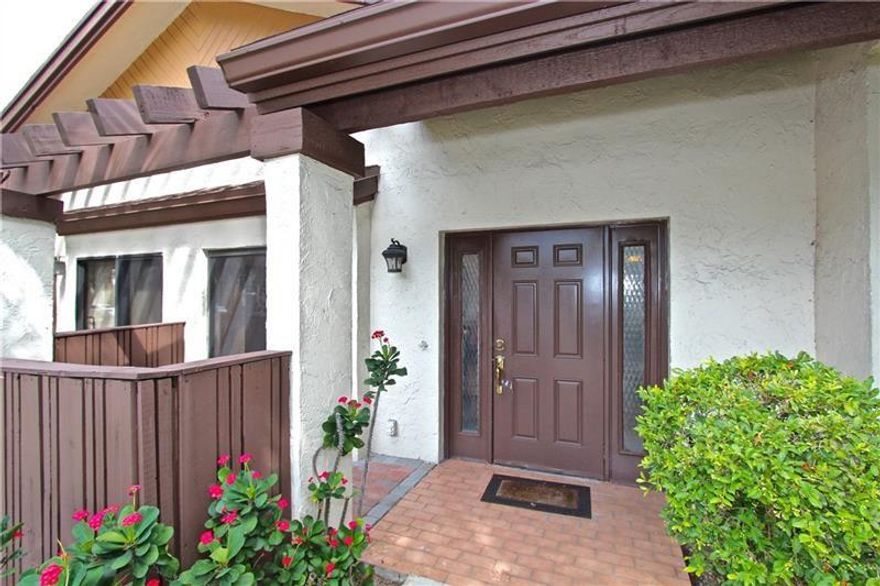 Highly desirable and rarely available updated villa. Updated kitchen with granite counters, cherry cabinets and stainless steel appliances. Updated bathrooms with marble walls and stone floor in shower. Travertine and wood floors. Screened patio with storage. Newer A/C, new water heater. Split bedroom plan. Great location close to turnpike shopping and Promenade.