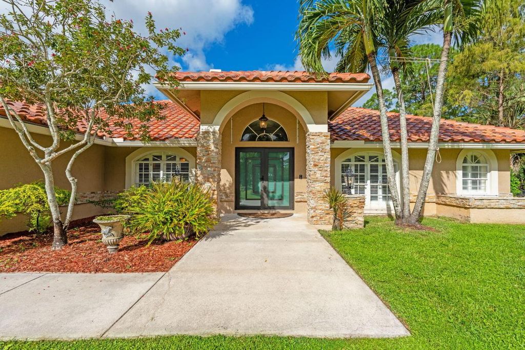 Photo of 2559 Palm Deer Drive, Loxahatchee, FL 33470 (MLS # R11131186)