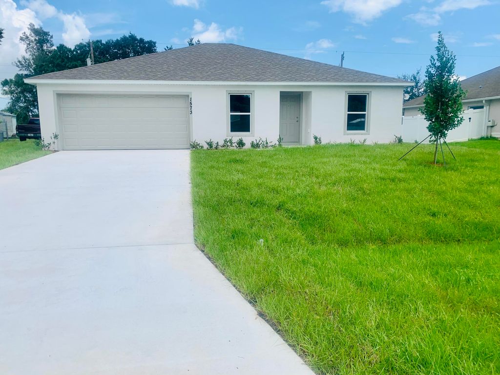 Photo of 1573 SW Leisure Lane, Port Saint Lucie, FL 34953 (MLS # R10733785)
