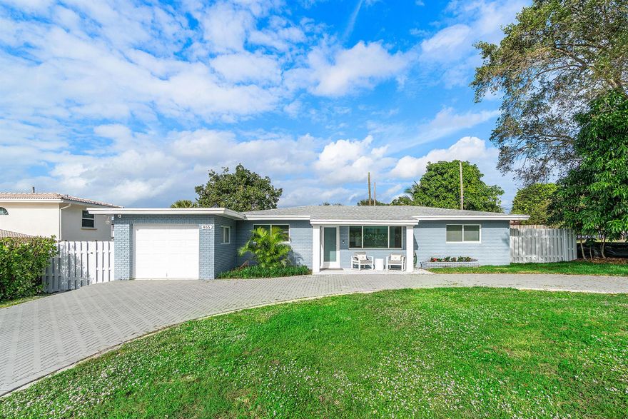 Located in the highly sought-after Conference Ridge, this absolutely stunning, fully renovated 4-bedroom, 2.5-bath residence offers a rare blend of refined design, everyday convenience, and an exceptional East Boca Raton lifestyle. Conference Ridge is prized for its quiet residential setting, mature landscaping, non-HOA freedom, and walkable proximity to dining, cafes, and daily conveniences, all while being centrally positioned in one of Boca Raton's most desirable corridors. The home has been thoughtfully and completely renovated with impeccable attention to detail, featuring porcelain flooring throughout, custom-designed closets, impact glass, and a chef's kitchen appointed with top-of-the-line KitchenAid appliances. A large circular driveway enhances curb appeal and provides ample