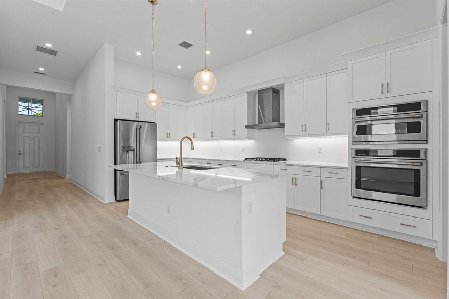 This Coastal Madison home at Mosaic, offers 4 bedrooms, 3 bathrooms with a modern, open concept living on an oversized, south-facing home site, with sun all day  long. The gourmet style kitchen features GE Cafe appliances with a gas cooktop, Cambria quartz countertops, under-cabinet LED lighting, and elegant pendant lighting over the island bar. Enjoy Mohawk laminate flooring throughout, high end tile bathrooms, a privacy wall with plumbing for a future summer kitchen, and a laundry room with cabinetry and counters. Located within the gated Mosaic community, residents enjoy resort-style pool, fitness center, and pickleball.