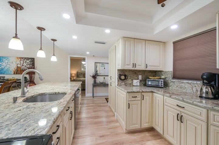 A East Boca Gem. A Beautiful, renovated unit that is move-in ready. The custom designed kitchen was designed with attention to every detail. Very large split bedroom plan with 2 full bathrooms. The area is one of the most desirable, Only 1 mile from beach, East of 95 off Yamato Road exit. The unit is facing East on the new proposed Boca Raton parks & recreational area . Beautiful extra large heated swimming pool, tennis courts, pickleball ,barbecue area and a club house for parties or events. This is a must see! Bike to beach ,location 5 min to Mizner Park and to Delray's Atlantic Ave, location is great!! close to all shopping and night life, and to all top rated schools and restaurant's. you will love this upgraded place to call home. Great location. beautiful Lobby & eveltors .