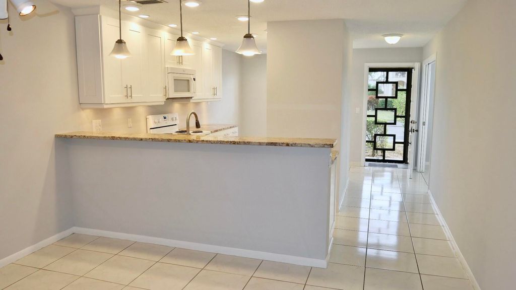 Photo of 13767 Flora Place #A, Delray Beach, FL 33484 (MLS # R11044099)