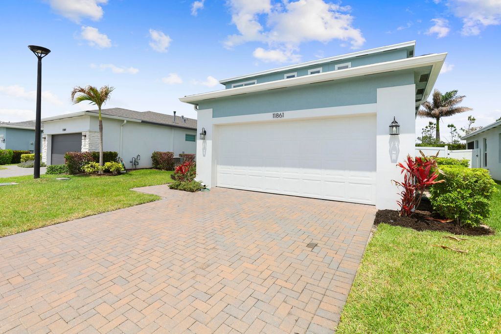 Photo of 11861 SW Lyra Drive, Port Saint Lucie, FL 34987 (MLS # B26018802)