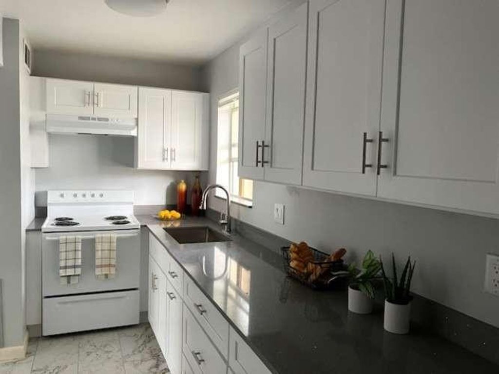 Photo of 317 Lake Evelyn Drive, West Palm Beach, FL 33411 (MLS # F10539871)