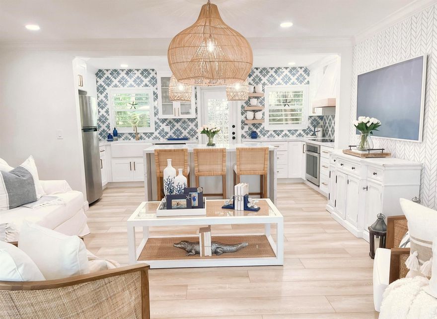 Escape to coastal bliss in this beautifully remodeled beach cottage, just steps from the sand and surf. Nestled in a serene seaside neighborhood, this thoughtfully designed getaway offers the perfect blend of modern comfort and timeless beach charm. Two bedrooms/two bathrooms, fully renovated with designer finishes and coastal-inspired decor, custom kitchen with quartz countertops, stainless steel appliances, and open shelving. A private outdoor patio with lounge seating and BBQ grill is ideal for morning coffee or evening cocktails. Central air conditioning, high-speed Wi-Fi, and smart TV for your convenience. Washer and dryer in unit. Parking included. Whether you're planning a romantic escape, a solo retreat, or a small family vacation, this stunning beach cottage is paradise.