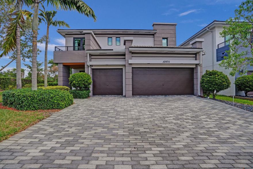 Nestled in the prestigious Cascata neighborhood of Parkland, known for its top-rated schools, this contemporary two-story home epitomizes modern luxury living. The residence features a sprawling open concept gourmet kitchen equipped with quartz countertops, stainless steel appliances, and an oversized island, perfect for entertaining. This pre-wired SMART home includes state-of-the-art upgrades such as Ring security, upgraded LED lighting, and impact windows and doors, ensuring both convenience and safety. The double front doors open to a grand entrance, leading to a spacious living room, an elegant formal dining room, and a cozy family room adjacent to the kitchen.

Upstairs, the home boasts four bedrooms plus a loft area, all with custom closets. The primary bedroom is a true retreat, complete with large walk-in closets and a luxurious ensuite featuring a walk-in shower and soaker tub. The property's exterior is just as impressive, featuring a brand new Van Kirk pool with a sun shelf, spa, waterfall, and fire features, all surrounded by a marble paver deck and a covered outdoor kitchen area. Situated on a quiet, secluded corner lot at the end of a cul-de-sac, the home offers pristine water front lake views.

Additional amenities include a 3-car garage, two clubhouses, a guard-gated entry, a Sportsplex with a fitness center, spin and exercise rooms, multiple pools, children's splash parks and play areas, both outdoor and indoor basketball courts, a ballroom, billiards room, tennis courts, saunas, and much more. This home not only offers luxurious indoor living but a vibrant community lifestyle as well.