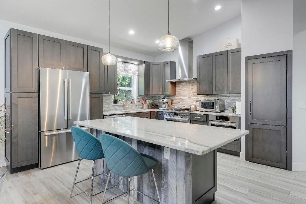 Photo of 496 Peacock Lane N, Jupiter, FL 33458 (MLS # R11100278)