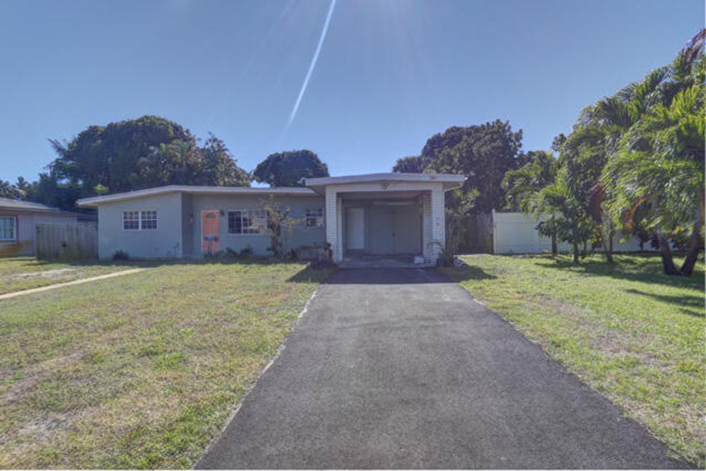 Photo of 328 E Jasmine Drive, Lake Park, FL 33403 (MLS # R11135049)