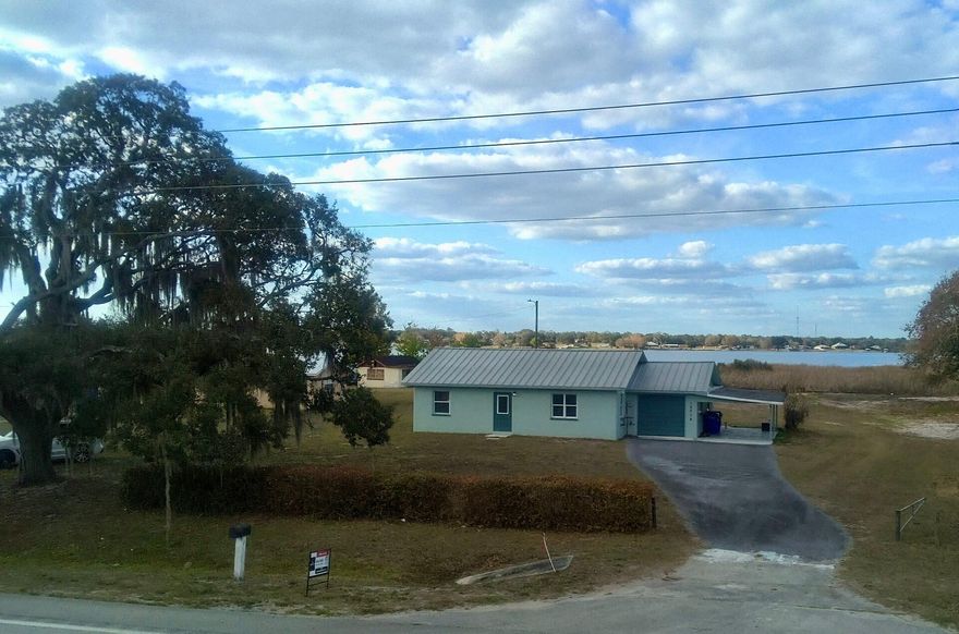 Discover Lakefront Living at Its Finest!

Experience the charm of lakeside living in this beautifully updated 2-bedroom, 1-bathroom home on Lake Red Beach in Sebring. Renovated in 2025, this home boasts top-of-the-line appliances, new kitchen cabinets, and stunning quartz countertops, along with a tastefully updated bathroom.

The air-conditioned garage, featuring matching tile flooring that flows seamlessly through the home, offers additional space for hobbies or storage, along with a carport. Enjoy an open floor plan perfect for entertaining, and a versatile loft area ideal for extra sleeping space or a cozy hangout. Situated on over .65 acres with more than 100 feet of water frontage, this property provides endless opportunities for recreation and relaxation, including a private ram