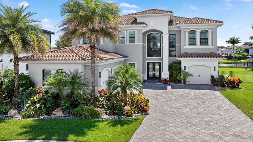 Set on one of the largest and most coveted pie lots in Boca Bridges, this stunning Palermo model is packed with upgrades and modern luxury. 5 bedrooms, 6.5 bathrooms + 2 Bonus rooms (6& 7th bedrooms) and private elevator. Chef’s kitchen with SubZero and Wolf appliances, upgraded cabinetry, backsplash, and an oversized island. Designer touches include custom closets, wet bar, dramatic feature walls, and wallpapered bathrooms. The first floor hosts a guest room and game room. A loft and a private movie room upstairs. The primary suite impresses with a custom wall unit, wood accent wall, and an expansive terrace. Outdoors, enjoy a turf backyard and a heated saltwater pool. 2 laundry rooms, 3 A/C zones. Boca Bridges offers resort style amenities including clubhouse, pool, tennis, pickle, gym