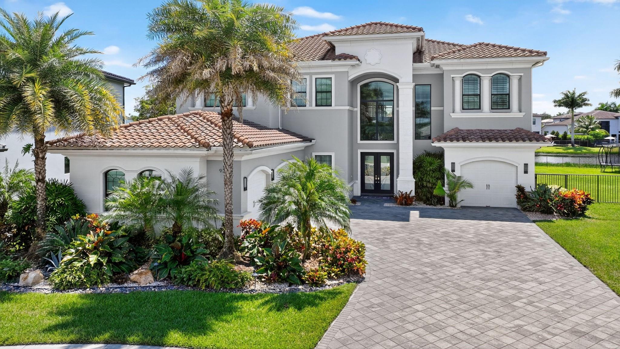 Set on one of the largest and most coveted pie lots in Boca Bridges, this stunning Palermo model is packed with upgrades and modern luxury. 5 bedrooms, 6.5 bathrooms + 2 Bonus rooms (6& 7th bedrooms) and private elevator. Chef’s kitchen with SubZero and Wolf appliances, upgraded cabinetry, backsplash, and an oversized island. Designer touches include custom closets, wet bar, dramatic feature walls, and wallpapered bathrooms. The first floor hosts a guest room and game room. A loft and a private movie room upstairs. The primary suite impresses with a custom wall unit, wood accent wall, and an expansive terrace. Outdoors, enjoy a turf backyard and a heated saltwater pool. 2 laundry rooms, 3 A/C zones. Boca Bridges offers resort style amenities including clubhouse, pool, tennis, pickle, gym