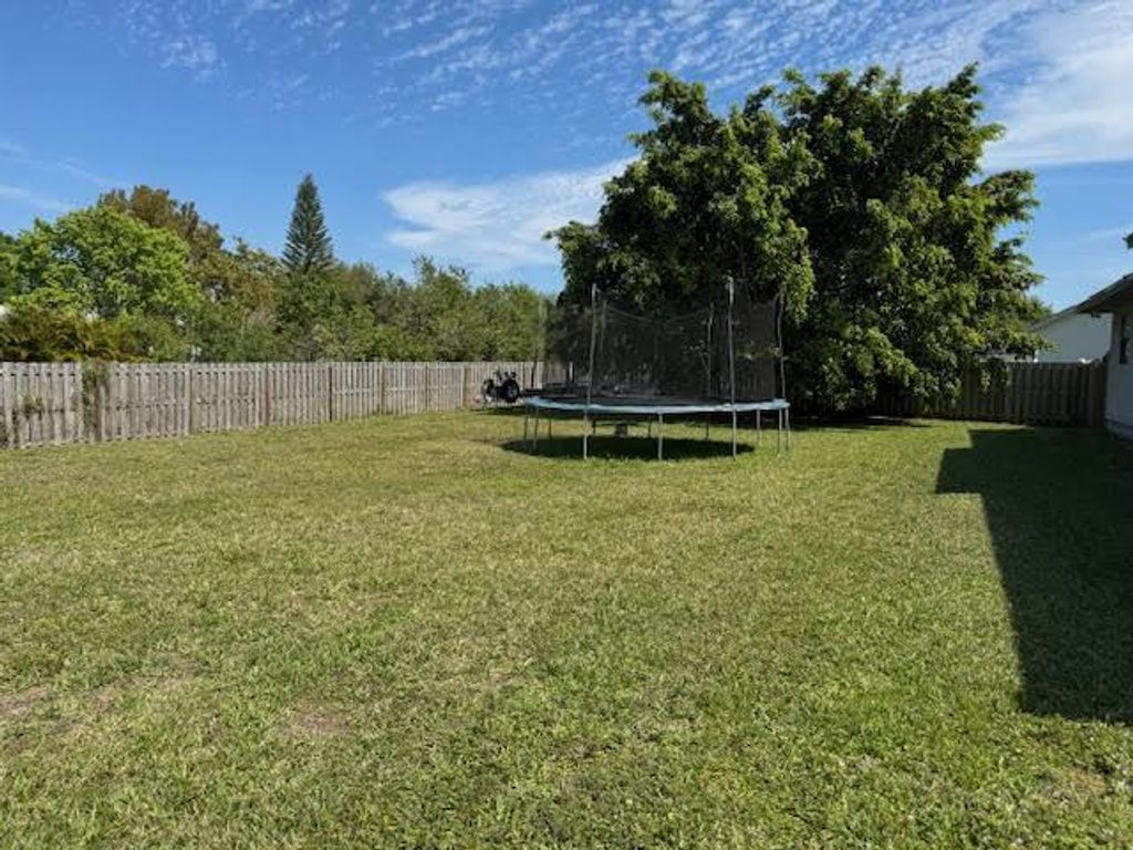Photo of 1109 SW Khan Drive, Port Saint Lucie, FL 34953 (MLS # R11074056)