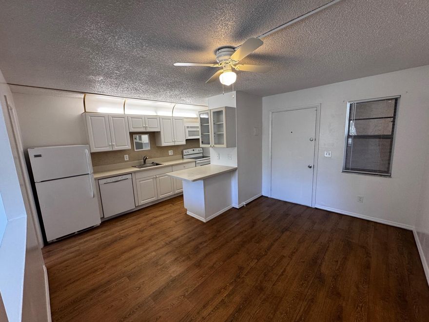 STUDIO END UNIT WITH NEW AIR CONDITIONER! Great investment opportunity! Whether you're looking to live in it or rent it out, this well-maintained 1-bedroom, self-sufficient condo is ideally located just off Route 1. The cozy, thoughtfully designed layout features a full kitchen, comfortable living room, separate bedroom, newer, full bath, and NEW air conditioner. Enjoy community amenities including a spacious green area, pool, recreation room, and on-site laundry. Perfect for easy living, a winter getaway, or a strong rental investment.