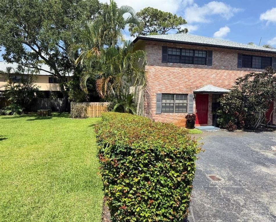 2 story townhome, corner/end 2 bedroom. 2 1/2 bath (not a condo) across the street from The LGBTQ+ Pride Center (pridecenterflorida org), parking for 8 cars, road is not a through street for cars. Walk to Publix, CVS, restaurants, & bars. Separate dining & living room, ceramic floors downstairs, brand new carpet upstairs, entire home freshly painted, new blinds, impact windows & doors, LED lights, Split bedrooms, spacious primary bedroom w/ room darkening blinds & newly updated bathroom. Full size washer/dryer. Private screened patio & private yard with plenty extra room to make the yard bigger. Tankless water heater 2024, AC 2014, roof 2023. HOA takes care of landscaping, irrigation, roof, exterior, reserves, Wind, hazard, & flood ins.