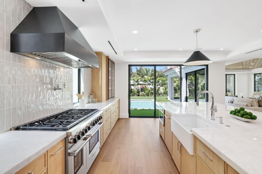 Located on one of Southland Park's most desirable streets, this 3,982-square-foot residence blends historic architectural charm with the comfort of a newly constructed home. Completed in 2025, the original structure was rebuilt and expanded to include four bedrooms, a private office or optional fifth bedroom, and 4.5 baths. Developed by Gus Renny, built by Steve Cury Construction, and designed by SMR Consulting, the home features wide-plank white oak floors, custom millwork, a marble fireplace, chef's kitchen, and spa-inspired baths. Outdoor living includes a resort-style pool, summer kitchen, balconies, and terrace. A rare 10-year tax abatement offers approx. $40K/year in tax savings. Minutes to Palm Beach Island, Worth Ave, beaches, dining, shopping, & PBI Airport.