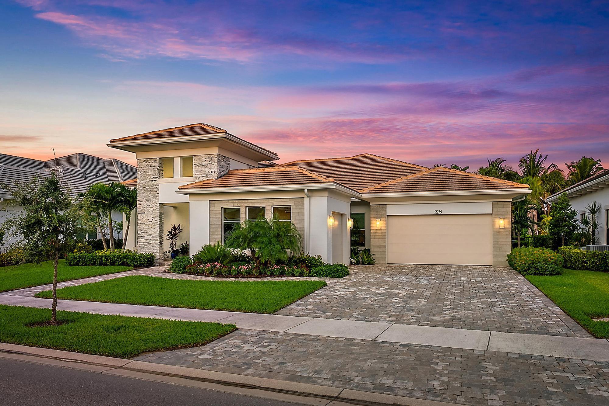 With over $300,000 in high-end upgrades, this 2023 Kenco-built residence in Coral Isles at Avenir offers a rare opportunity to own a better-than-new home in one of Palm Beach Gardens' most sought-after communities. The Antigua model spans 3,247 square feet with four bedrooms, four full baths, and two separate garages offering three spaces, delivering a modern open layout that combines timeless design with everyday functionality.Tall ceilings and expansive living areas create a sense of scale and light, while hurricane-impact windows throughout the home ensure peace of mind year-round. Eastern exposure in the rear brings in abundant natural light and creates a private backyard setting that's bright in the morning and comfortably shaded in the evening.
