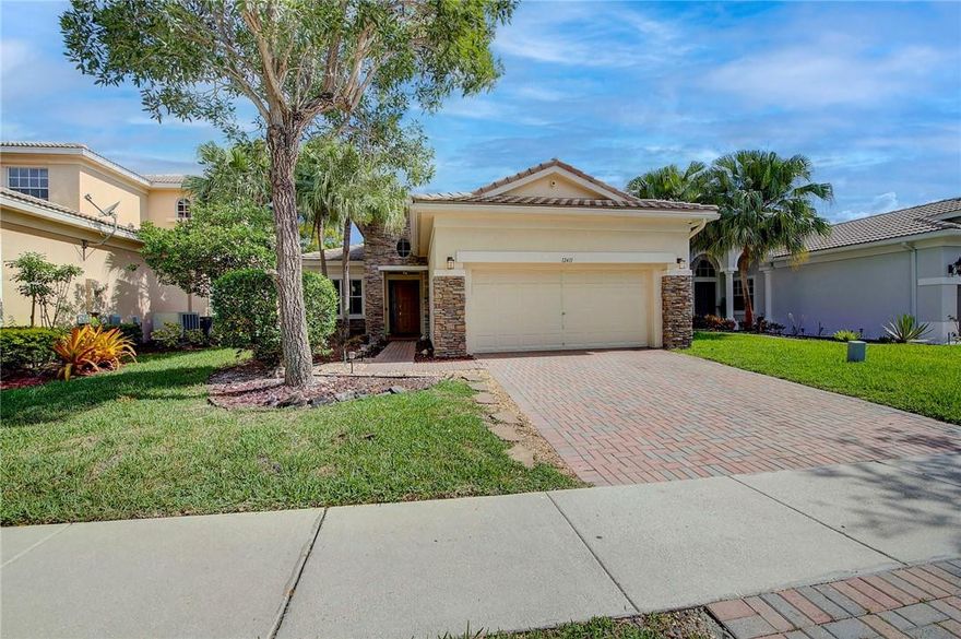 PRICED TO SELL! This Beautiful single family home in one of Parkland's best community's, Heron Bay. This home offers 3 oversized bedrooms, 2 full bathrooms, 2 car garage with a nicely paved driveway, a fully upgraded kitchen with a HUGE beautiful island and stainless steel appliances.  The home has 18x18 tiles throughout the main living areas and wood in the bedrooms. Some extras to the home include; a built in speaker system, peaceful patio, crown molding, high ceilings, laundry room, newer A/C, garage luggage racks and more.  HOA includes lawn maintenace. Heron Bay offers: community pools, tennis courts, a splash pad for kids, covered tot lot, 2 gyms, 3 guard gates, secured patrol at night, indoor & outdoor racquetball courts.  Please see broker remarks for showings.