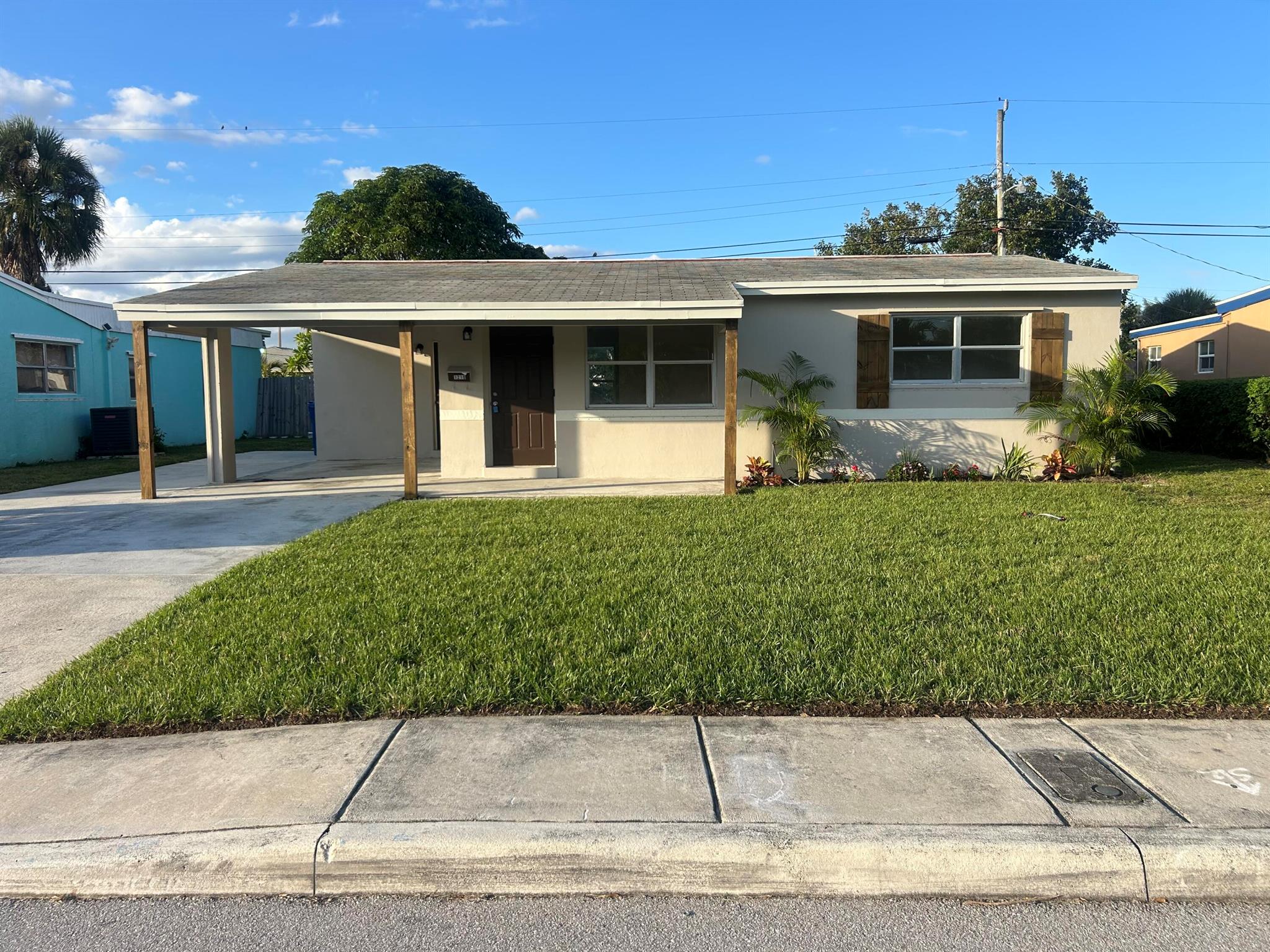 Move-in ready and beautifully updated, this 2-bedroom, 1-bath home has it all. Features include a 3-car carport, brand new central A/C, new kitchen with cabinets, countertops, microwave, stove & refrigerator, plus new washer/dryer and tankless water heater. Bathroom fully upgraded with new tub, vanity & toilet. Fresh new flooring throughout and great curb appeal with new grass & flowers in the front yard.Seller is willing to give credits towards a new roof contingent of the sale price!Also features a mango tree in the back yard.Every detail is brand new--just minutes from the beach, shopping, and dining. Don't miss this turnkey gem!