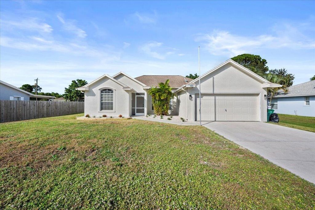 Photo of 233 NE Glentry Ave, Port Saint Lucie, FL 34983 (MLS # R11140488)