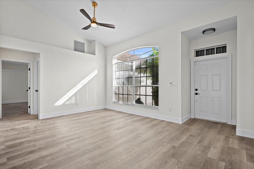 Photo of 233 NE Glentry Ave, Port Saint Lucie, FL 34983 (MLS # R11140488)