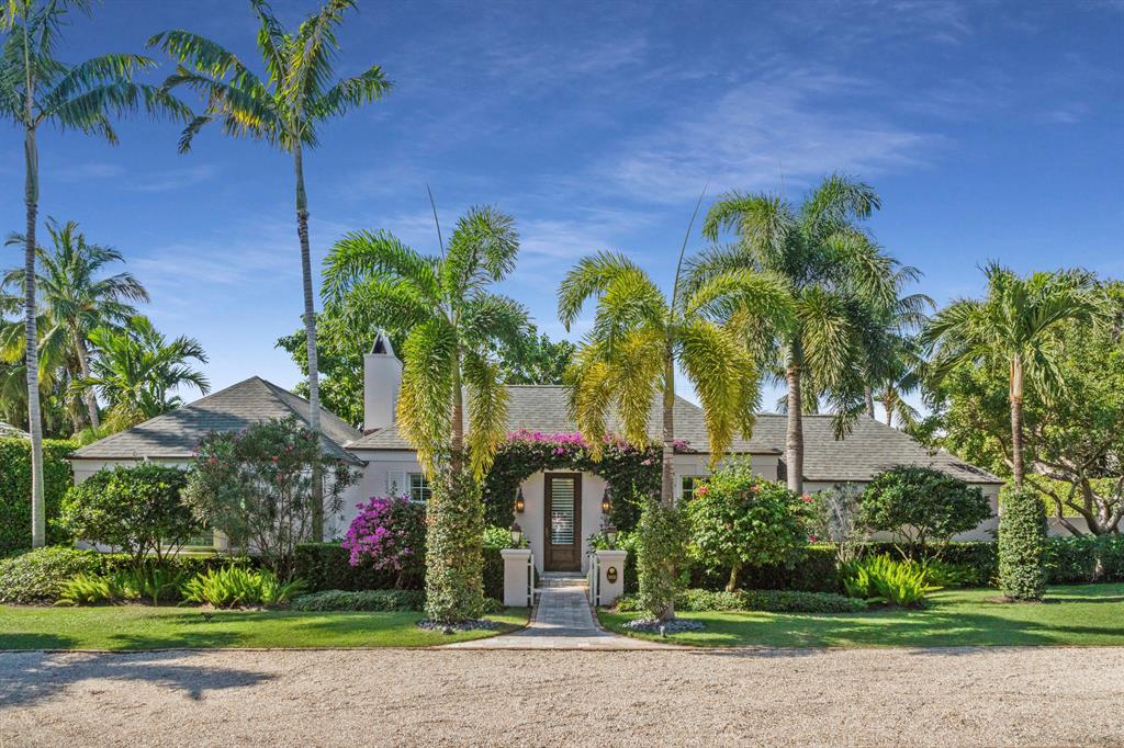 Just two blocks from the beautiful Atlantic ocean, nestled on a spacious lot in the Town of Gulfstream, this totally re-imagined Bermuda island classic awaits. A storybook courtyard front entrance welcomes you into this three bedroom, 3.1 bath open floor plan with cathedral ceilings and flowing living, dining and entertaining spaces. The masterfully designed interior by Bungalow Design is dominated by soothing hues of white creating a feeling of calm tranquility. Quality craftsmanship and top of the line appliances and fixtures throughout. The back yard is a tropical oasis with mature trees and foliage, a spacious lanai and inviting pool, spa and summer kitchen.