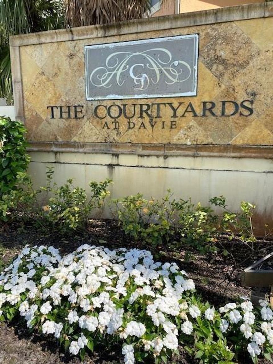 Secluded corner unit with private entry in the COURTYARDS at DAVIE! This spacious first-floor unit features a large kitchen and living area and a private patio perfect for entertaining. The comfortably sized bedrooms have plenty of closets and storage space. The unit is located directly across from the tennis courts. Other amenities include a clubhouse, pool, and hot tub, all in a gated community. It is located just around the corner from Nova Southeastern University, Florida Atlantic University, and other great schools in the Davie area.