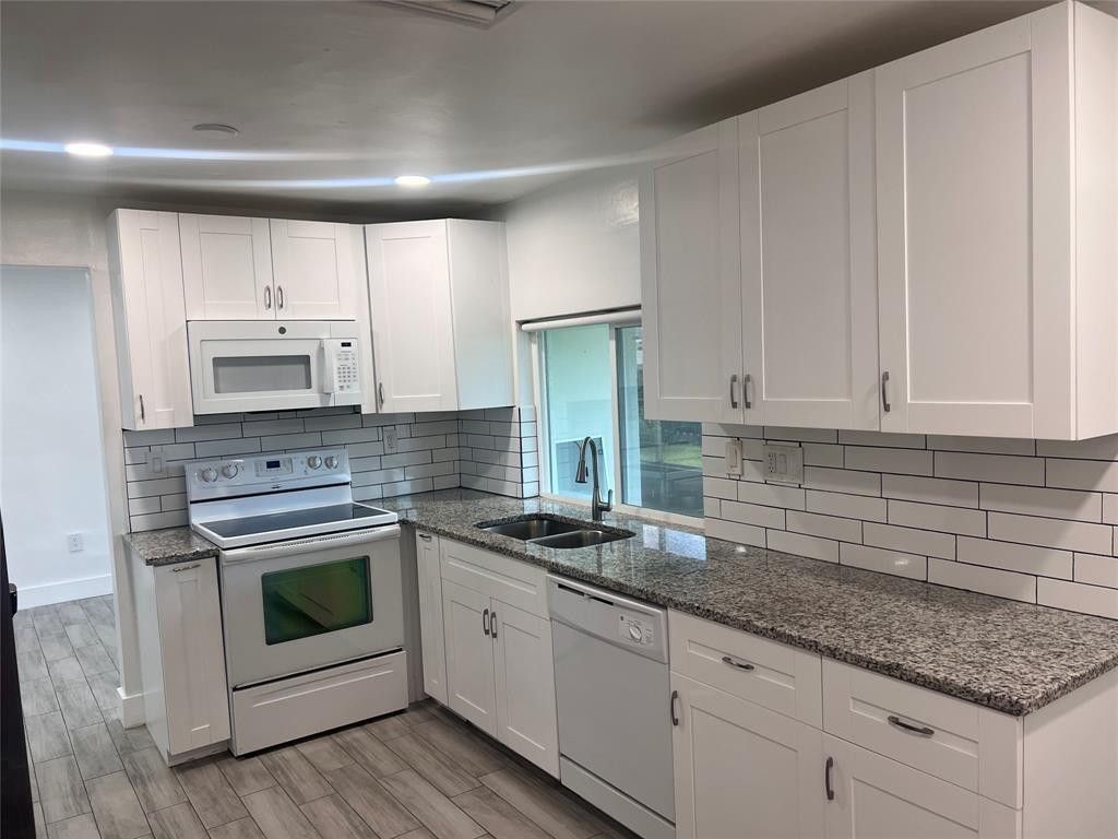 Photo of 8361 NW 27th Place, Sunrise, FL 33322 (MLS # F10540236)