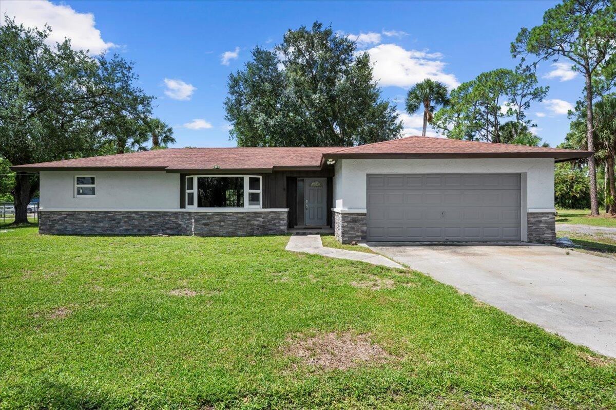 Welcome to your dream home in the serene community of WPB. No HOA, bring all your toys. This stunning 3/2 CBS home is situated on over an acre of lush, private land, offering you the perfect blend of luxury & tranquility. Enjoy a renovated kitchen equipped with stainless steel appliances, granite countertops, & plenty of storage. The expansive living and dining areas are perfect for entertaining. Hurricane impact windows. Step outside to your private backyard haven, complete with a covered patio, perfect for al fresco dining and relaxation. The vast yard offers endless possibilities. Plenty of room for the whole family. Brand new AC. and Duct work. Newly renovated bathrooms. Bring all the animals. Don't miss out...schedule your showing today!