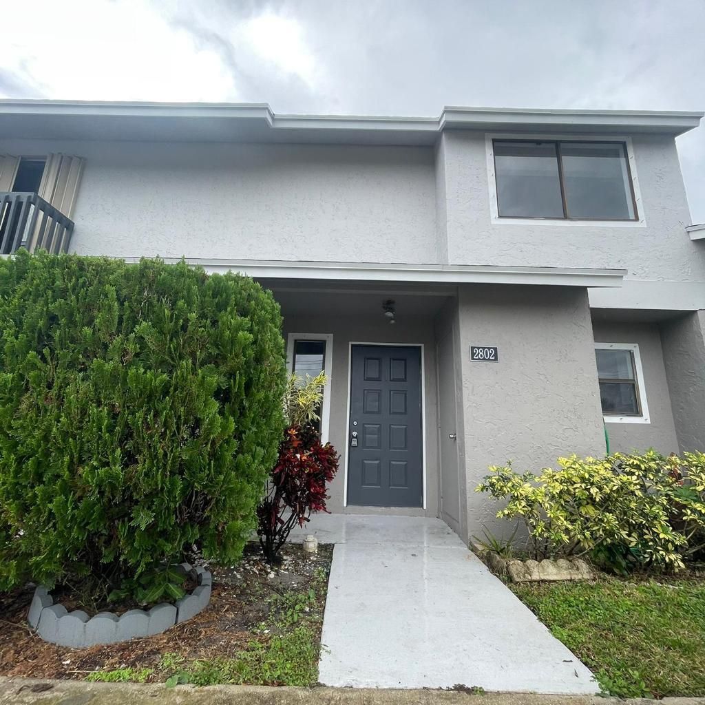 Photo of 2802 Canalside Drive, Greenacres, FL 33463 (MLS # R10943413)