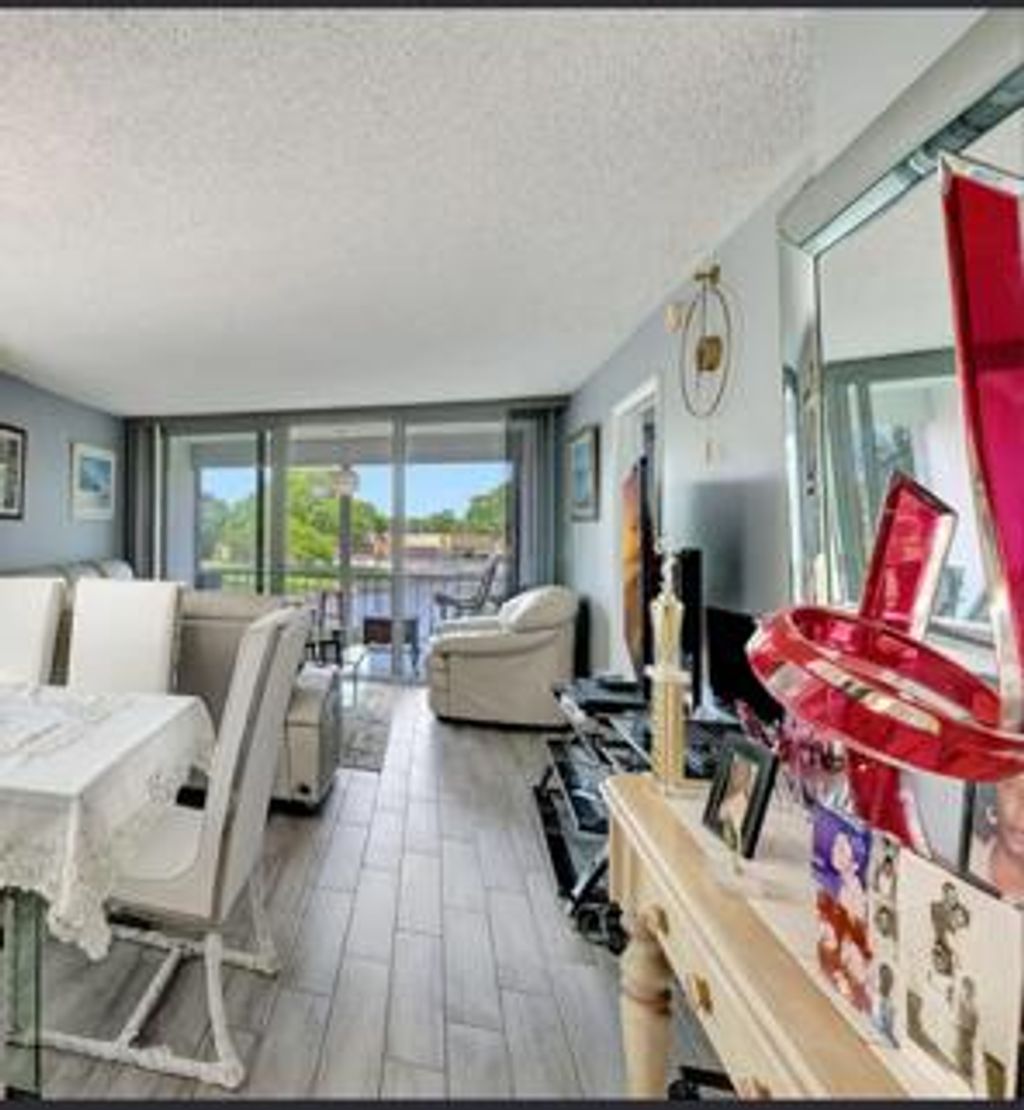 Photo of 5860 NW 64th Avenue #201, Tamarac, FL 33319 (MLS # B26032344)
