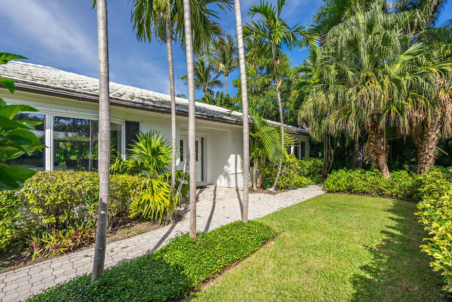 Light and bright Bermuda style 4-BD, 3-BA + den on the highly desirable North End. Very private with lush tropical landscaping, expansive pool area, and spacious 2-car garage. Close proximity to the beach and lake trail.