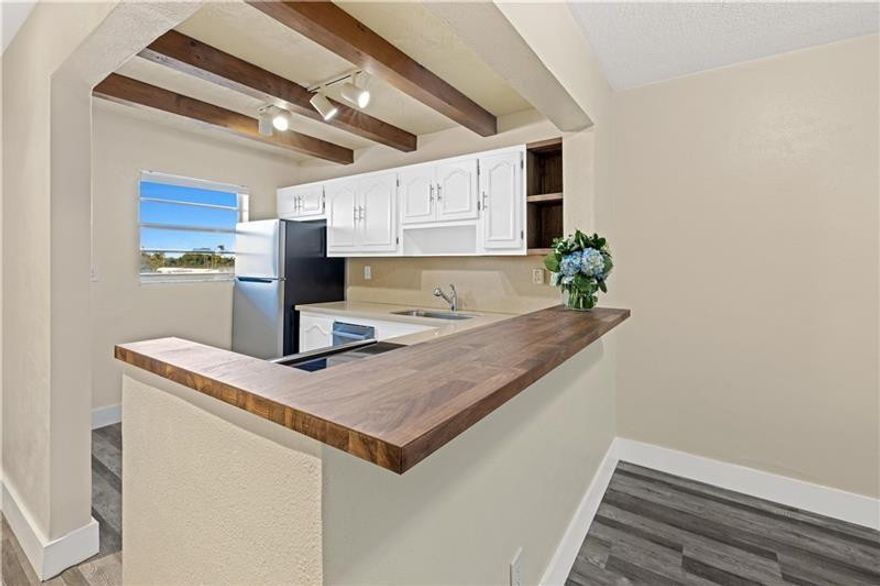 Location, location, location! This beautifully updated 2 bed, 2 bath condo in the highly sought after community, Coral Ridge Isles, features a spacious floor plan, kitchen with gorgeous Stainless Steel appliances, and beautiful bedrooms/ bathrooms. Pool and community laundry room have been recently renovated. Enjoy your morning coffee on the beautiful balcony overlooking the canal. Great location for kayaking, paddle boarding, boating, and fishing! Close to highways, beach, grocery stores, and more. Per association: maximum 1 pet with a maximum weight 20 lbs.