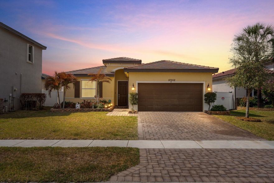 Ideally situated in the desirable Copper Creek community, 12552 NW Toblin Lane is a beautifully upgraded 2019 CBS home with 3 bedrooms and 2 bathrooms. Inside, enjoy a renovated kitchen with stainless steel appliances, custom backsplash, and added cabinetry, plus updated bathrooms with custom tilework. The main living area features a custom bar and electric fireplace, with tile throughout and LVP in guest rooms - no carpet. Step outside to your private backyard oasis with a vinyl-fenced yard and outdoor kitchen, perfect for entertaining and year-round Florida living. Low HOA includes access to a clubhouse, fitness center, pool, playground, and sports courts - minutes from everything Port St. Lucie offers.