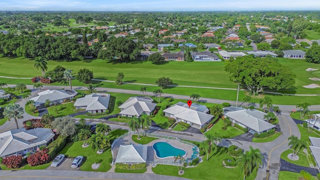 Photo of 119 Driftwood Circle, Atlantis, FL 33462 (MLS # R10923620)