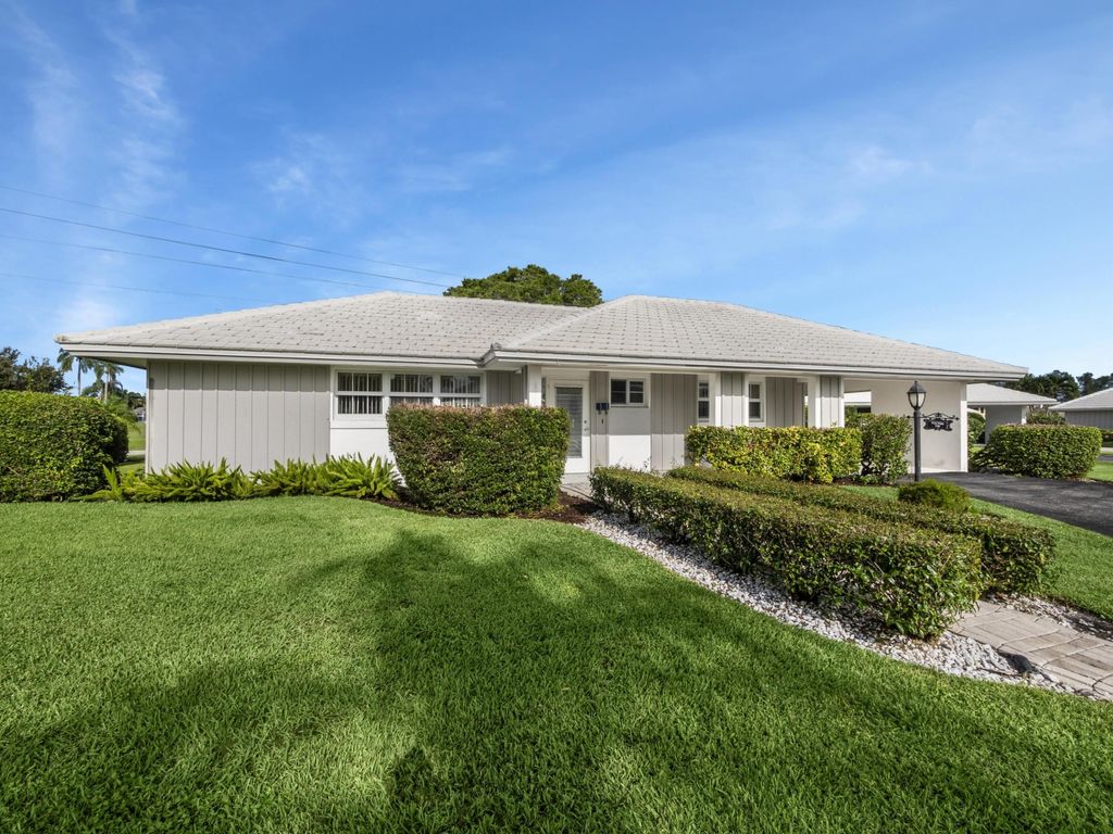 Photo of 119 Driftwood Circle, Atlantis, FL 33462 (MLS # R10923620)