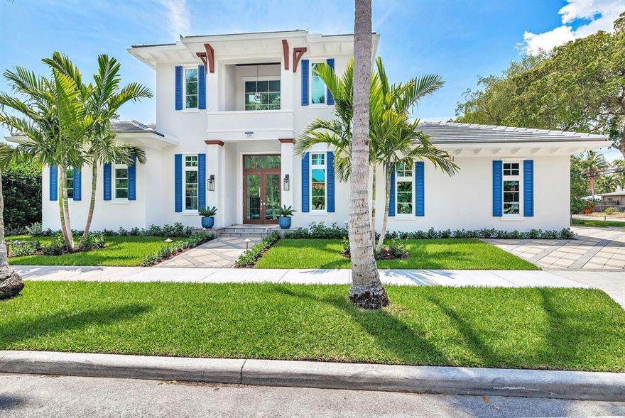 Welcome to your dream home! This stunning new construction, British West Indies-designed house is a true masterpiece with many custom details, boasting soaring ceilings, abundant natural light, and an open floorplan that seamlessly connects the living room, dining, and kitchen, making it ideal for entertaining. Located on the Intracoastal block in a coveted coastal Historic neighborhood.As you enter the house, you'll be greeted by a grand foyer that sets the tone for the rest of the home. The fully retractable sliding door wall suits Florida's indoor/outdoor lifestyle.The kitchen is a chef's dream featuring top-of-the-line appliances, six burner gas range, custom cabinetry, an expansive quartz island, and a decorative marble backsplash.