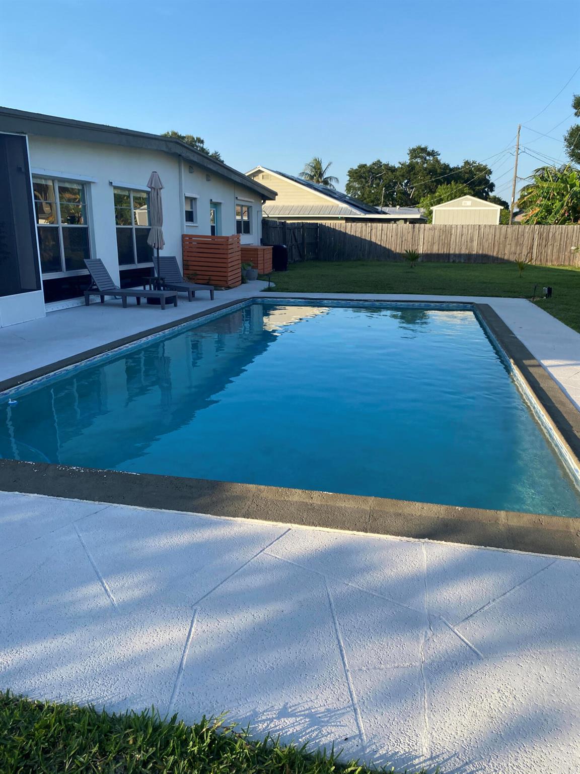 Mid-Century CBS modern home with 21st-century enhancements. No HOA, no restrictions. Desirable Vero Shores safe neighborhood, only five miles from the beach. Full hurricane protection includes shutters and custom hurricane garage doors.15X30 heated saltwater pool (2020heat pump, 2018energy-efficient V/S pool pump, 2024 saltwater system) Screened porch with ceiling fan overlooking large fenced backyard. Terrazzo floors throughout, renovated kitchen: gas range, SS appliances, custom cabinets, r/o filtration, pantry, laundry room. Features high ceilings-bright airy interiors. Electric updated:200amps/2020, insulated 2-car garage, 2018 Main H20 line repiped w/new shut-off valve. Located close to shopping, pharmacy, gas, and groceries. Live the Florida Dream! Rmsizeapprox.