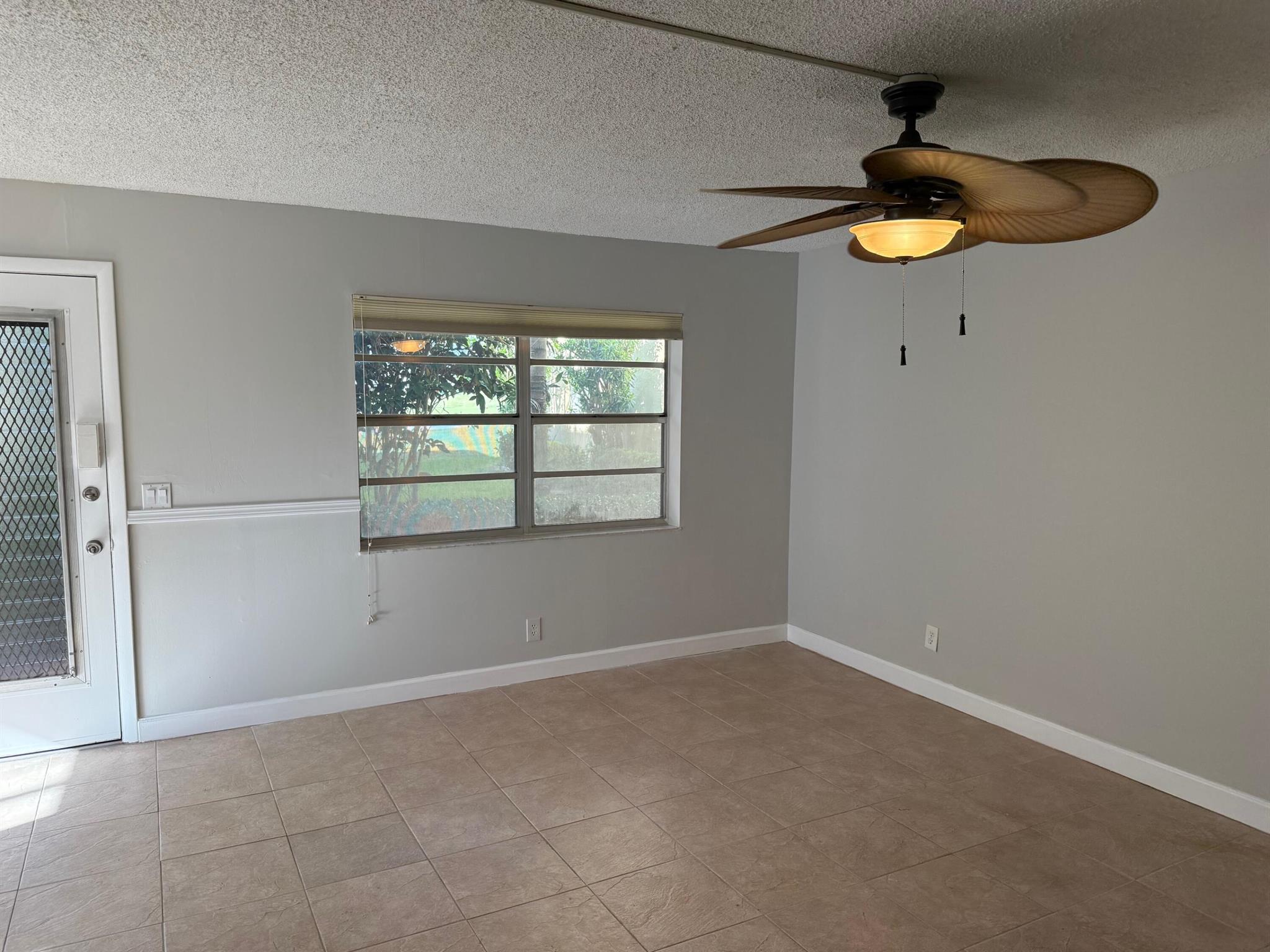 Here is a change to try Florida living at a introduction price!  55+ community with so much to offer. Pools, Golf,Theater and Clubhouses!  Unit has 2 bedroom, 2 baths, enclosed patio with washer and dryer room, on the ground floor. Tiled floors and a view of the golf course from your front window. Freshly painted, brand new kitchen appliances. It's ready to make it your own! Many upgrades and add more as you want them.Assigned parking space #32 next to main walkway.
