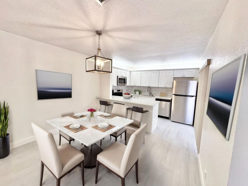 Photo of 97 Lake Arbor Drive, Palm Springs, FL 33461 (MLS # R10978496)