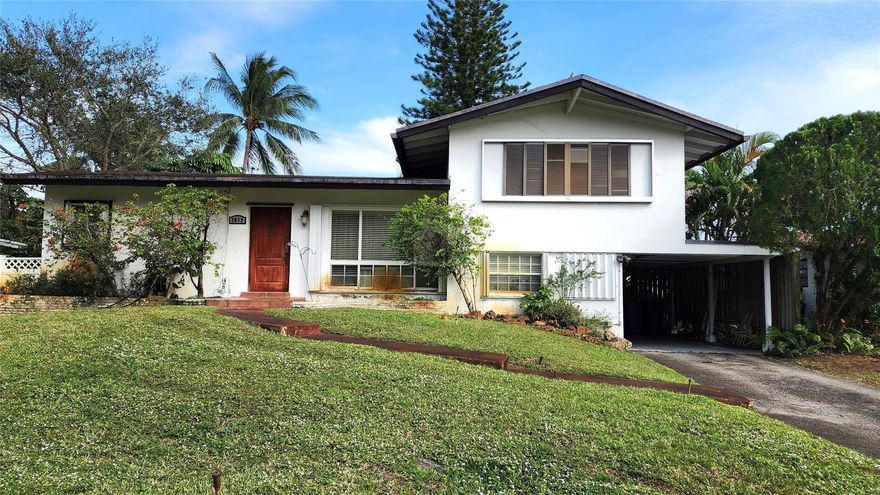 Tri-level deepwater fixer-upper. Sold AS-IS. Approx 60+/- feet of seawall. Desirable layout with generous room sizes. Home sits high on the lot. Anticipated upgrades include air conditioning, windows, roof, some termite/water damage, etc. A 2005 whole-house generator has an in-ground gas tank, accordion shutters, plenty of room for a pool, and electric was updated in 05'. — great opportunity to make this your dream home. Drive around and see the wonderful renovations people are making to these tri-levels. Sight-unseen offers will not get a response.